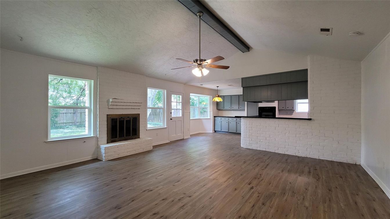 Empty room, Fireplace, Interior, Kitchen, Pendant Lights, Wood Texture Flooring