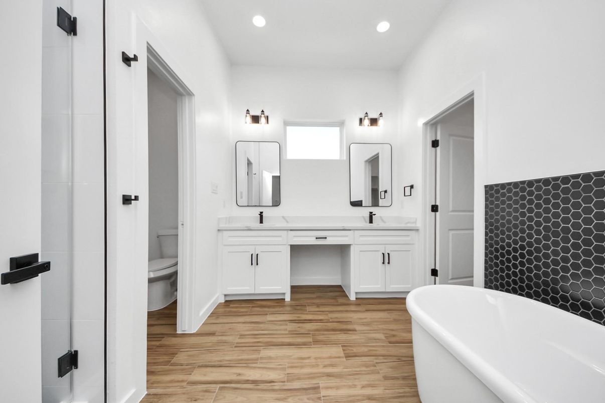 Bathroom, Dual Sink Vanities, Free Standing Baths, Interior, Recessed Lighting, Wood Texture Flooring