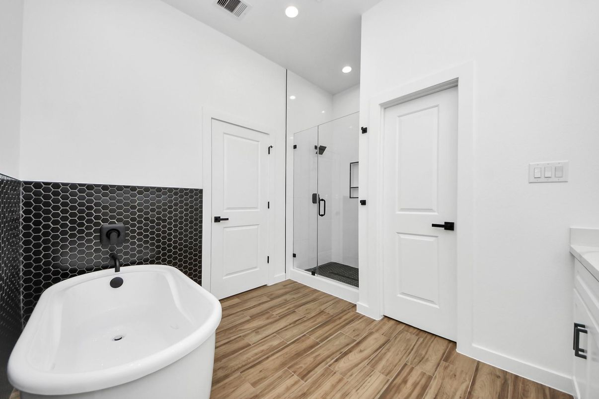 Bathroom, Free Standing Baths, Glass Shower, Interior, Recessed Lighting, Wood Texture Flooring