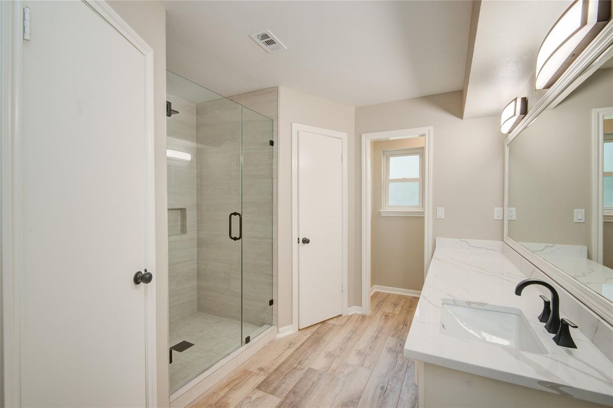 Bathroom, Dual Sink Vanities, Glass Shower, Interior, Wood Texture Flooring