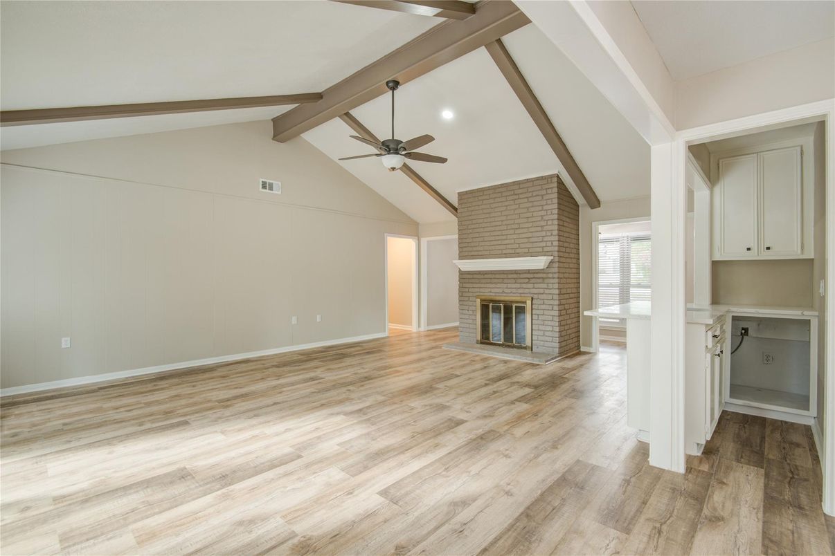 Empty room, Fireplace, Interior, Recessed Lighting, Stone Walls, Wooden Beams, Wood Texture Flooring