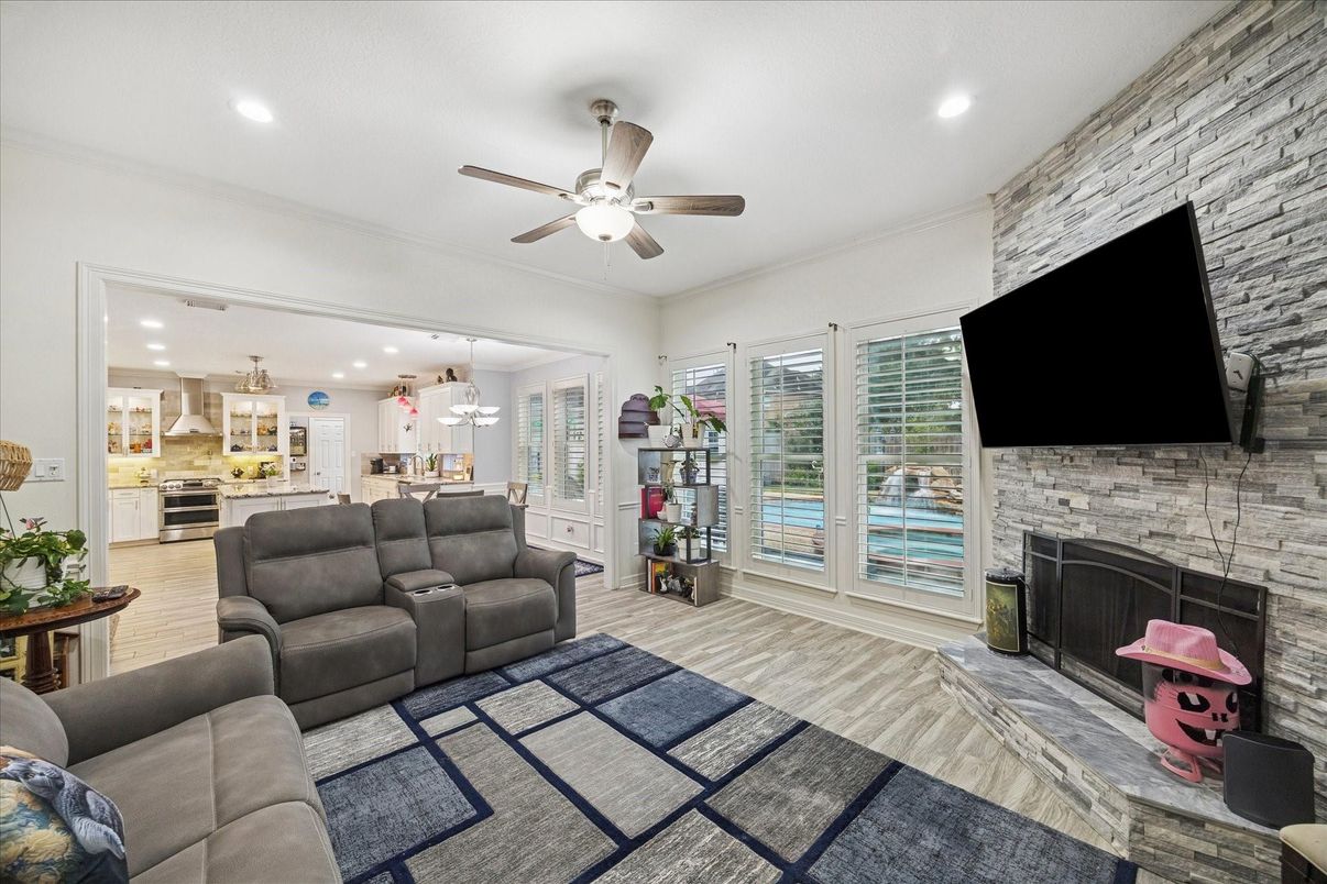 Fireplace, Interior, Kitchen, Living room, Pendant Lights, Recessed Lighting, Stainless Steel Appliances, Stone Walls