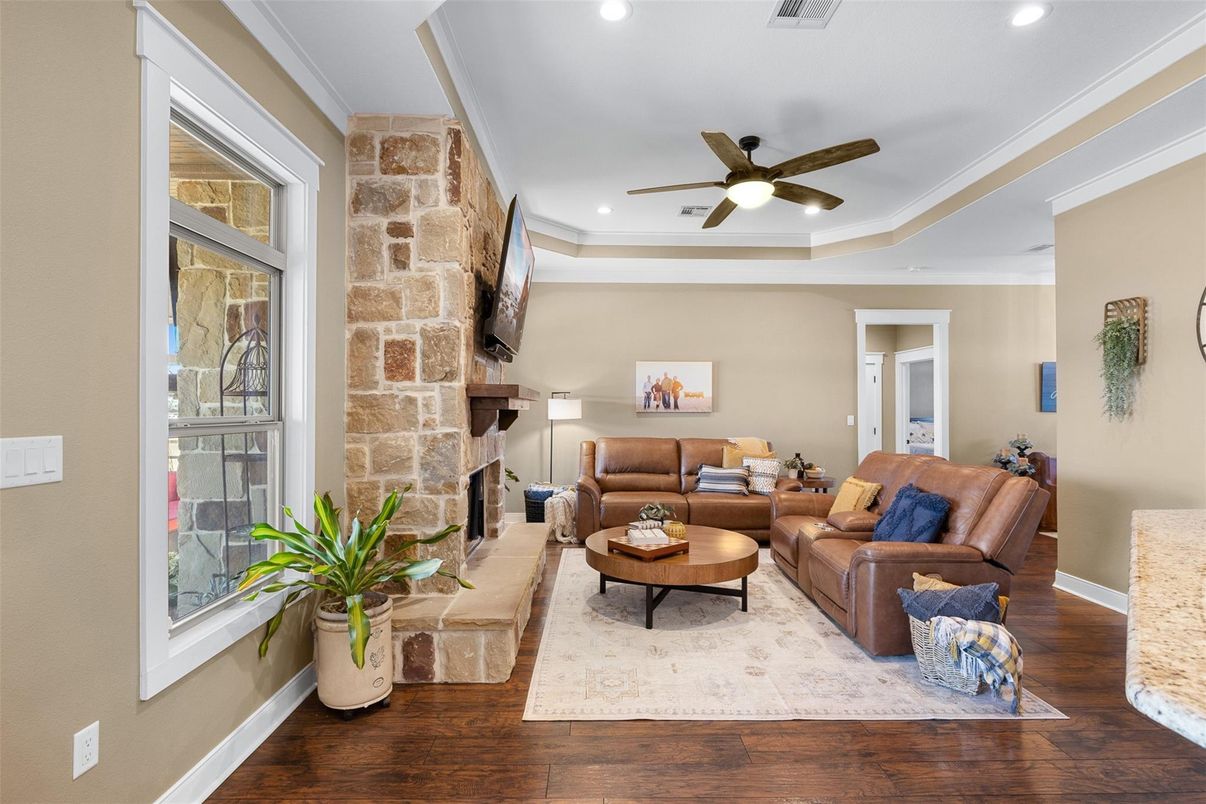 Fireplace, Interior, Living room, Recessed Lighting, Stone Walls, Wood Texture Flooring