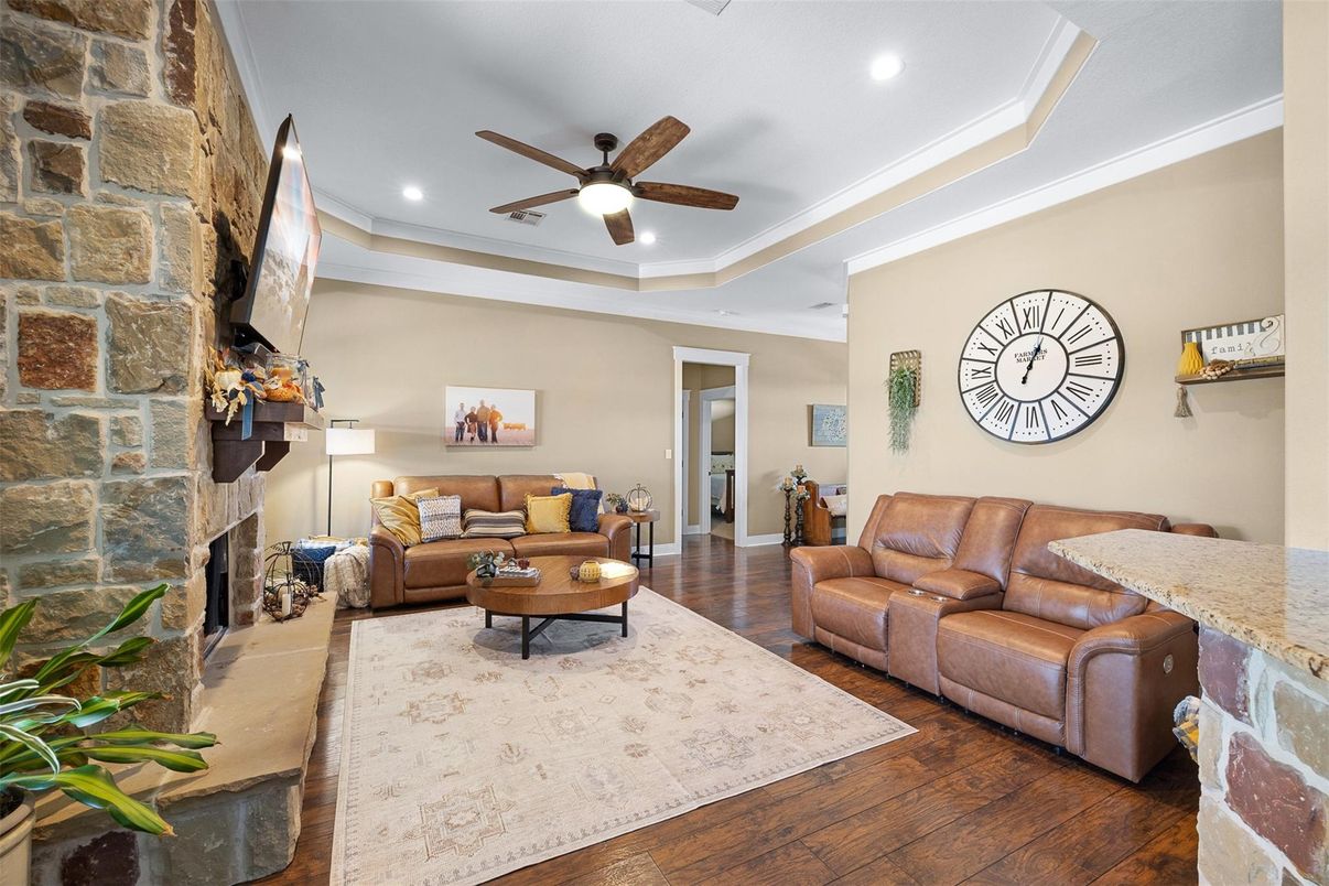 Fireplace, Interior, Living room, Recessed Lighting, Stone Walls, Wood Texture Flooring