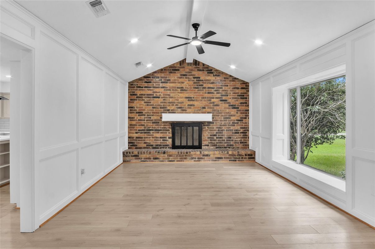 Empty room, Fireplace, Interior, Recessed Lighting, Stone Walls, Wood Texture Flooring