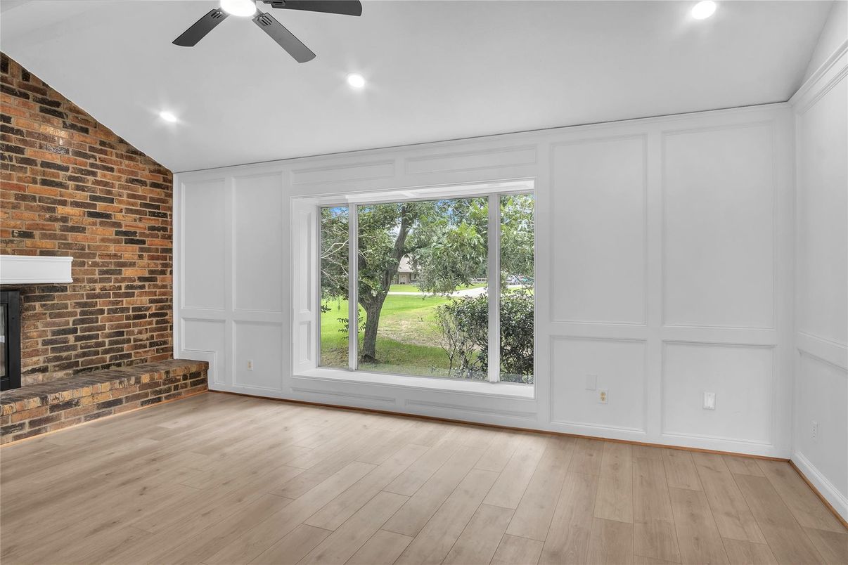 Empty room, Fireplace, Interior, Recessed Lighting, Stone Walls, Wood Texture Flooring