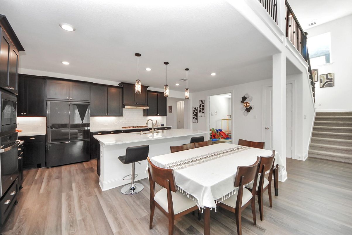 Dining room, Interior, Kitchen, Pendant Lights, Recessed Lighting, Stainless Steel Appliances, Wood Texture Flooring