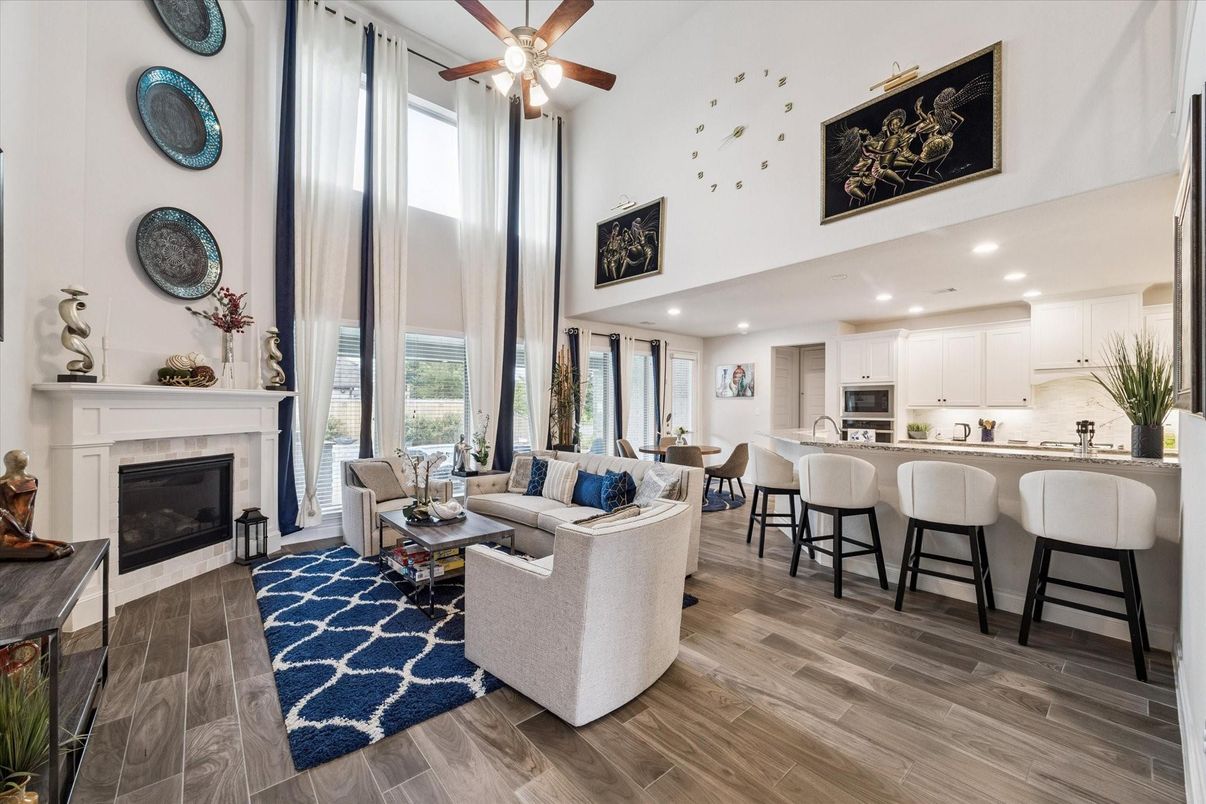 Dining room, Fireplace, Interior, Kitchen, Living room, Recessed Lighting, Stainless Steel Appliances, Wood Texture Flooring