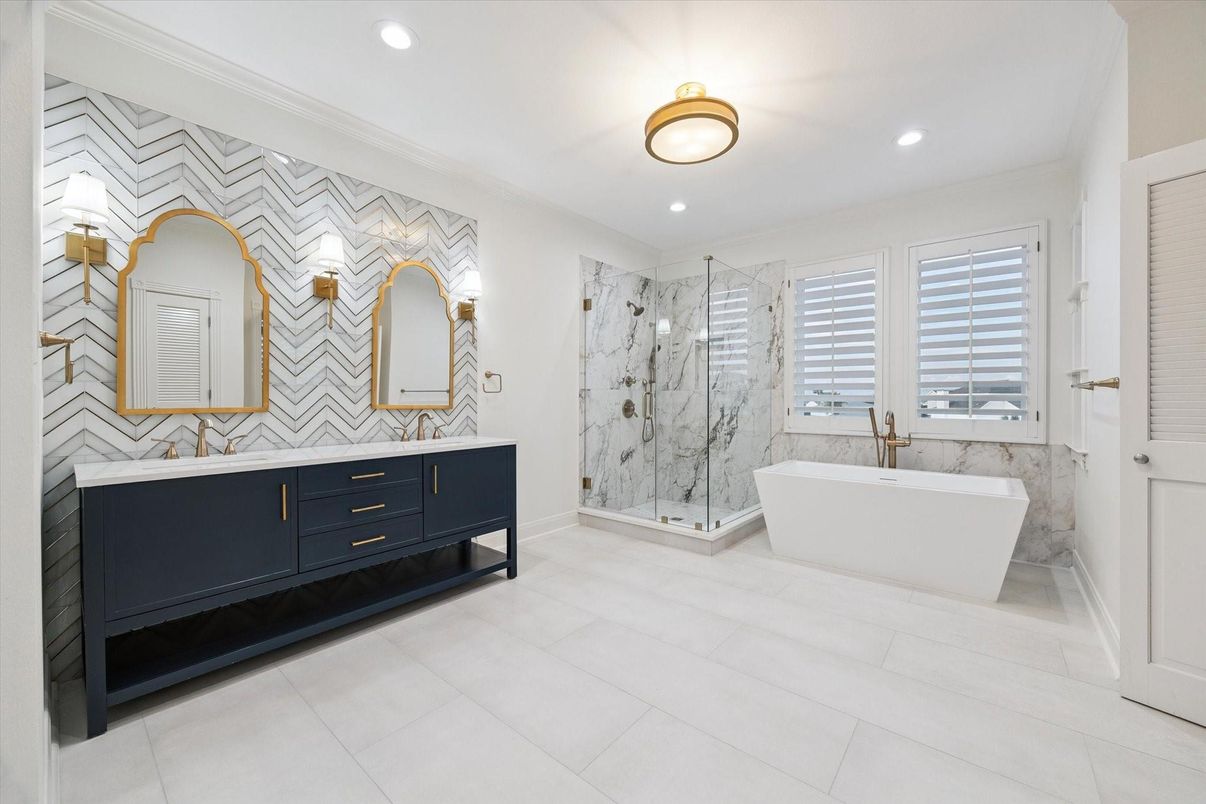 Bathroom, Dual Sink Vanities, Free Standing Baths, Glass Shower, Interior, Marble Walls, Recessed Lighting