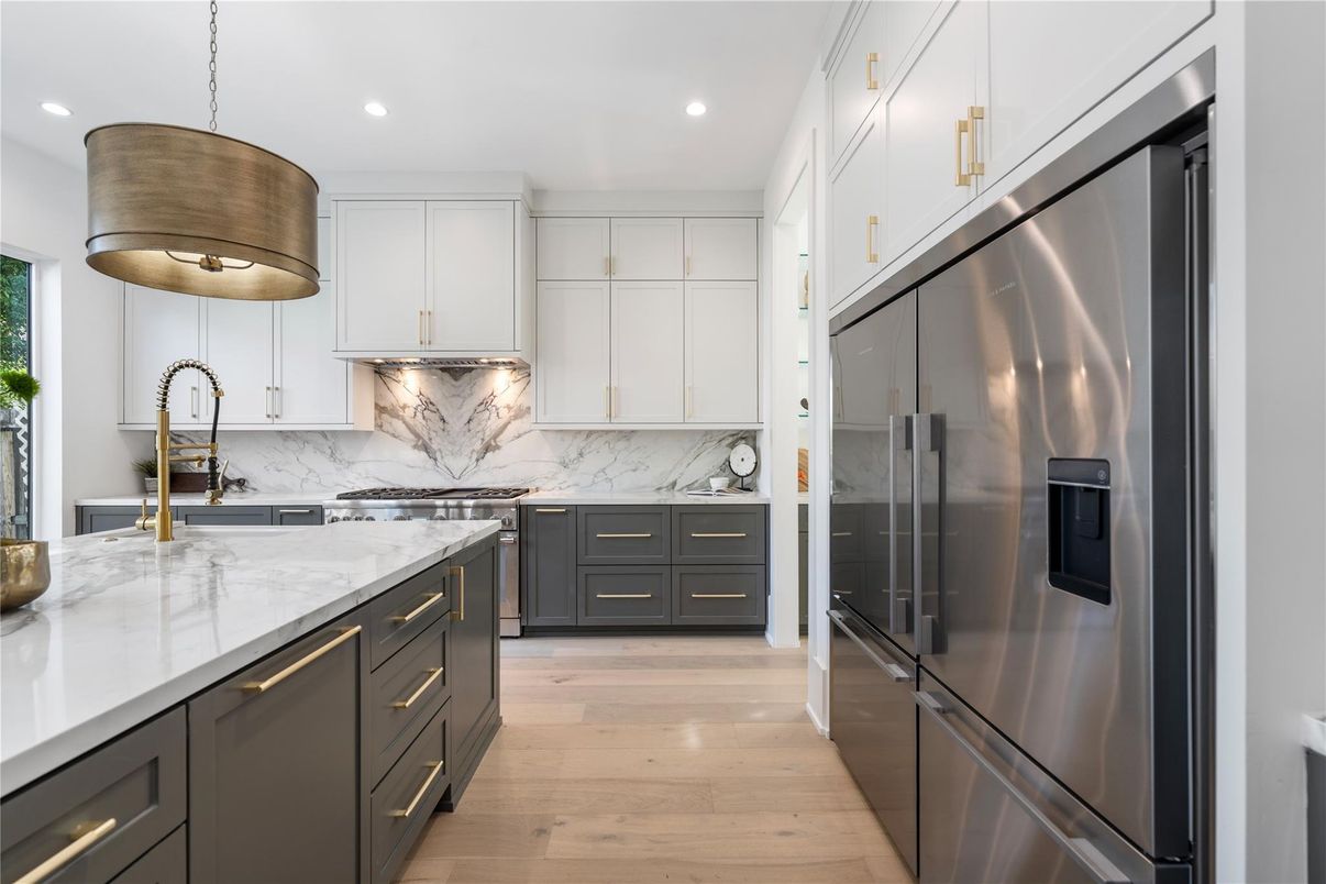 Interior, Kitchen, Marble Walls, Pendant Lights, Recessed Lighting, Stainless Steel Appliances, Wood Texture Flooring