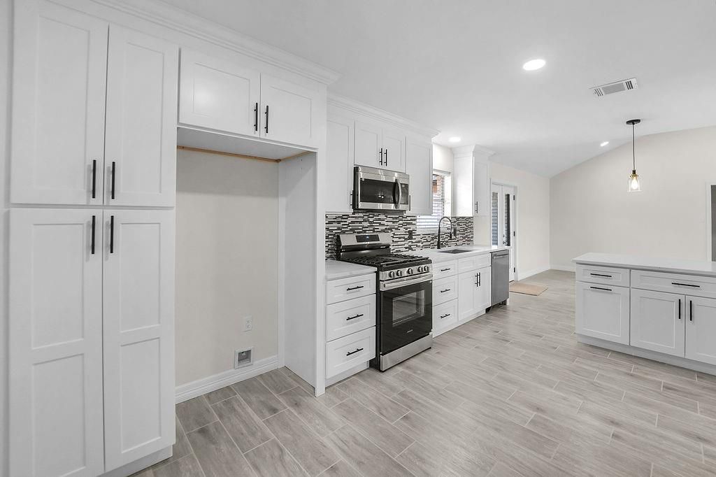 Interior, Kitchen, Pendant Lights, Recessed Lighting, Stainless Steel Appliances, Wood Texture Flooring