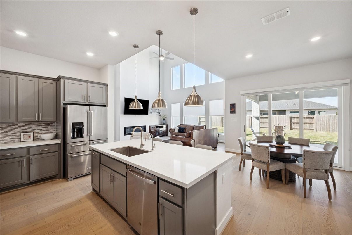 Dining room, Interior, Kitchen, Pendant Lights, Recessed Lighting, Stainless Steel Appliances, Wood Texture Flooring