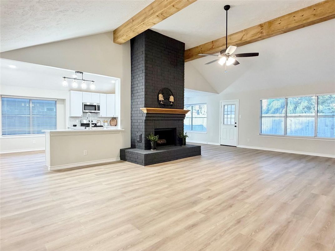 Empty room, Fireplace, Interior, Kitchen, Pendant Lights, Stone Walls, Wooden Beams, Wood Texture Flooring