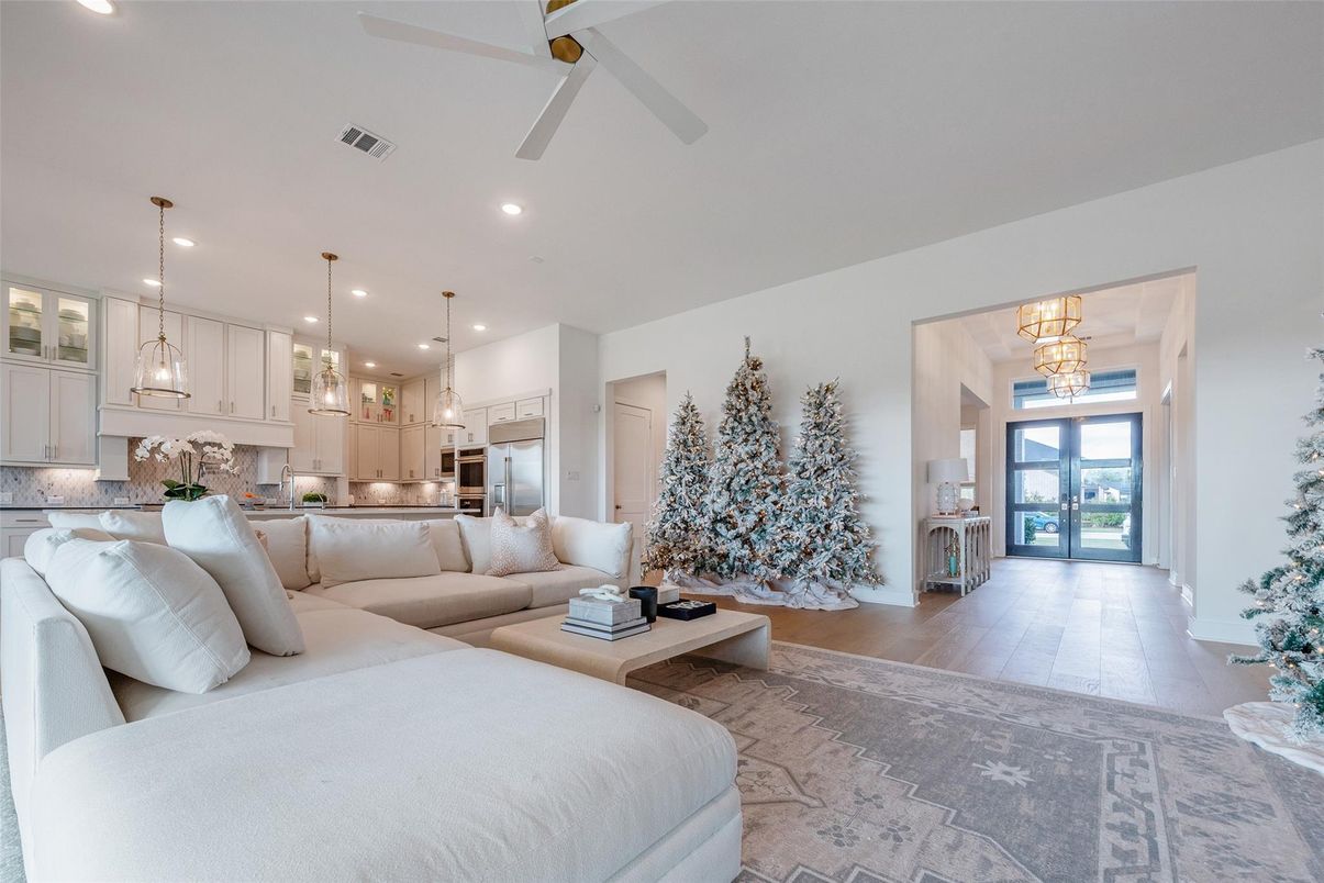 Chandelier, Interior, Kitchen, Living room, Pendant Lights, Recessed Lighting, Stainless Steel Appliances, Wood Texture Flooring