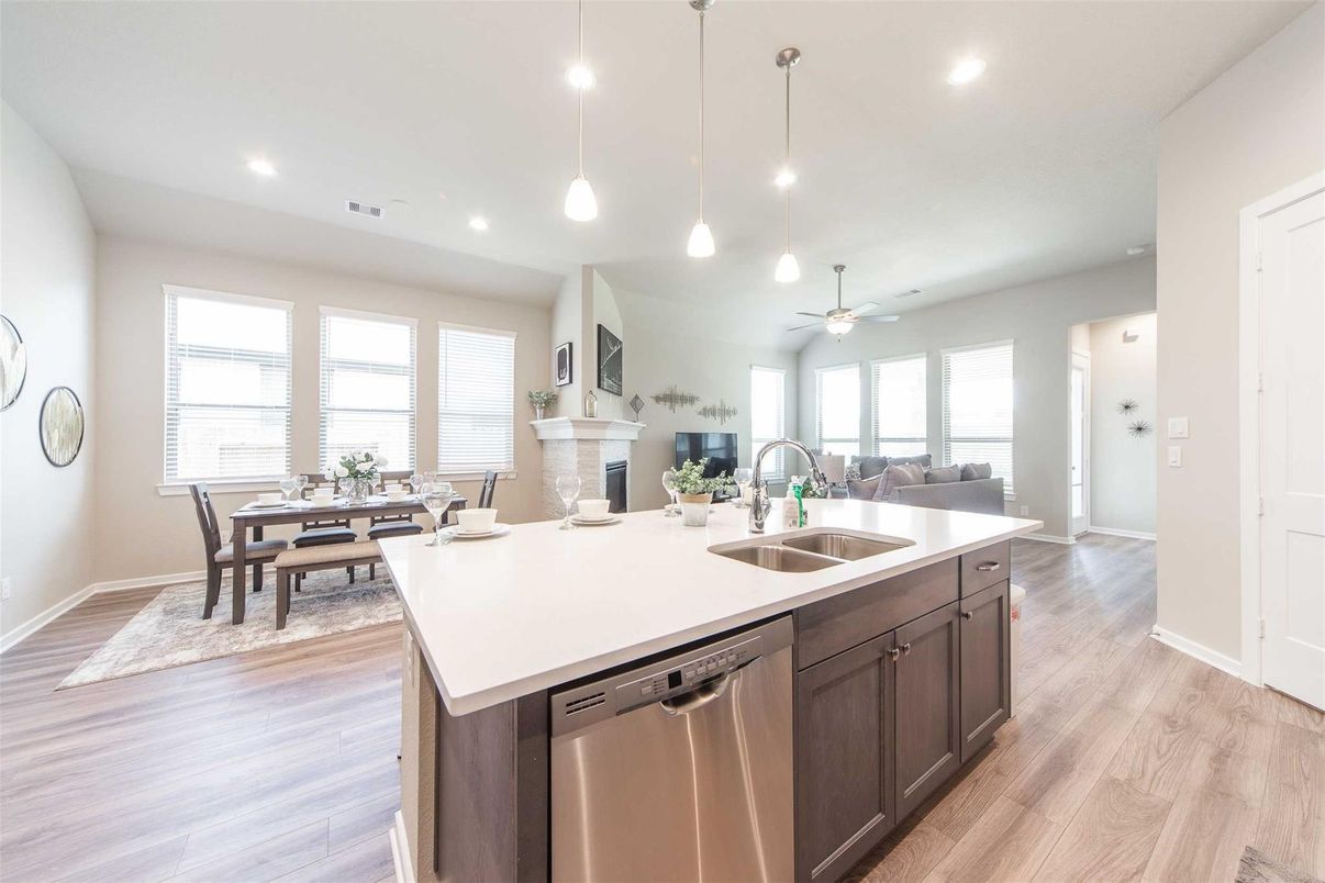 Dining room, Fireplace, Interior, Kitchen, Pendant Lights, Recessed Lighting, Stainless Steel Appliances, Wood Texture Flooring