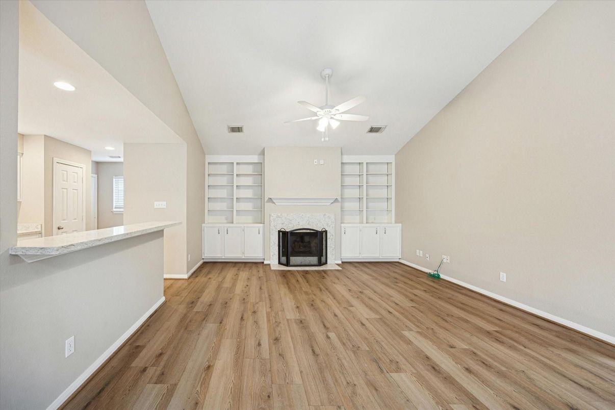 Empty room, Fireplace, Interior, Recessed Lighting, Wood Texture Flooring