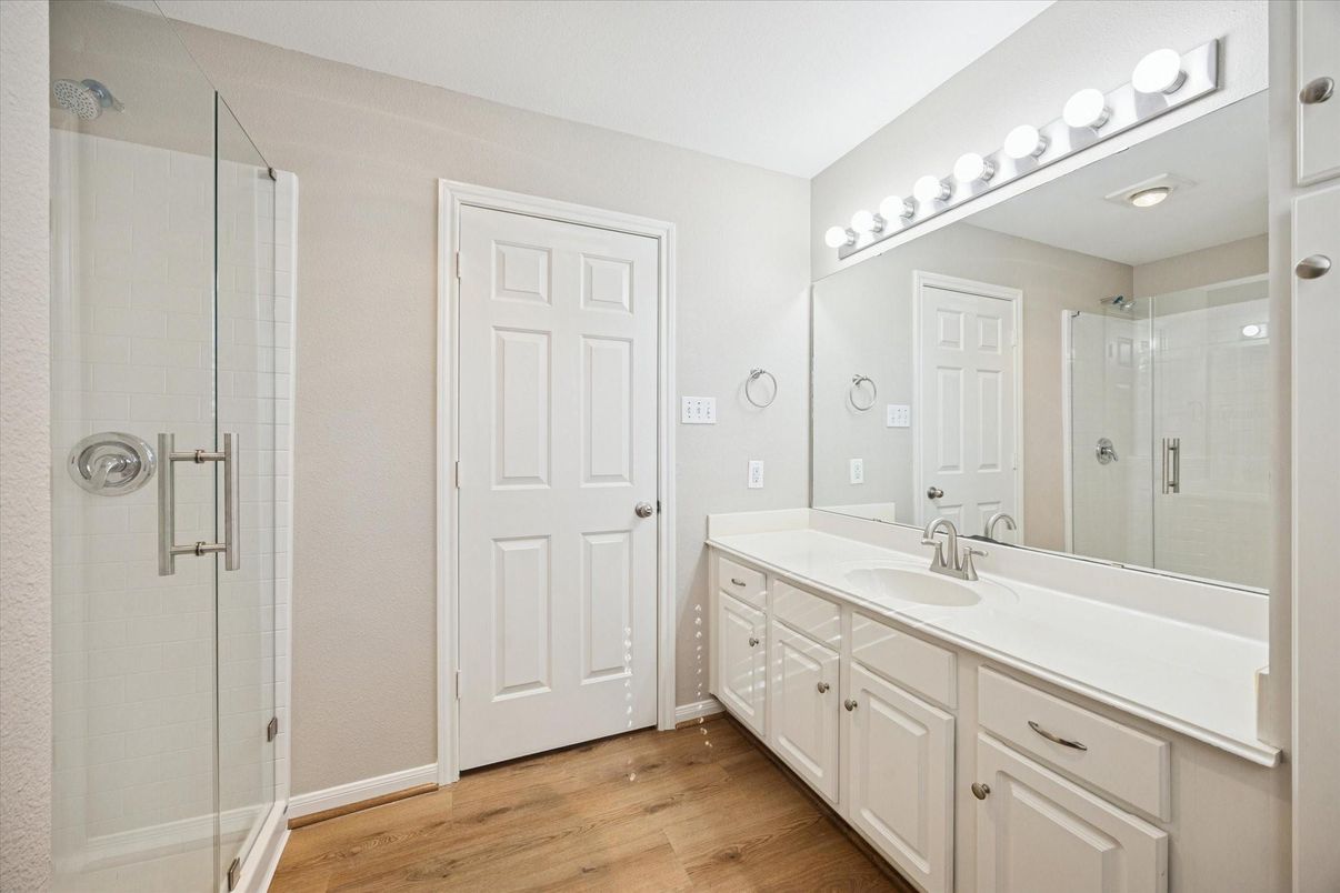 Bathroom, Dual Sink Vanities, Glass Shower, Interior, Wood Texture Flooring