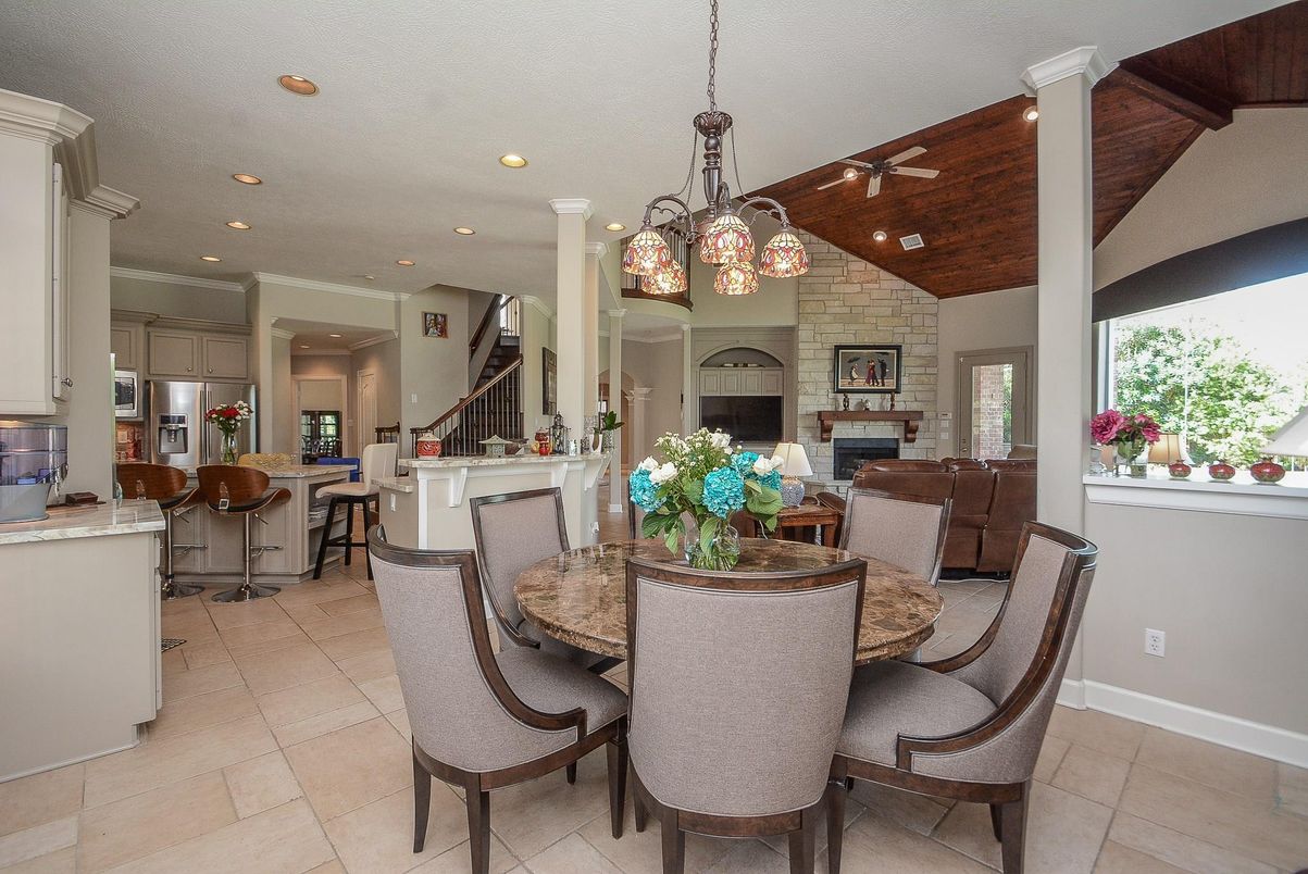 Dining room, Fireplace, Interior, Kitchen, Living room, Pendant Lights, Recessed Lighting, Stainless Steel Appliances, Stone Walls, Wooden Ceilings