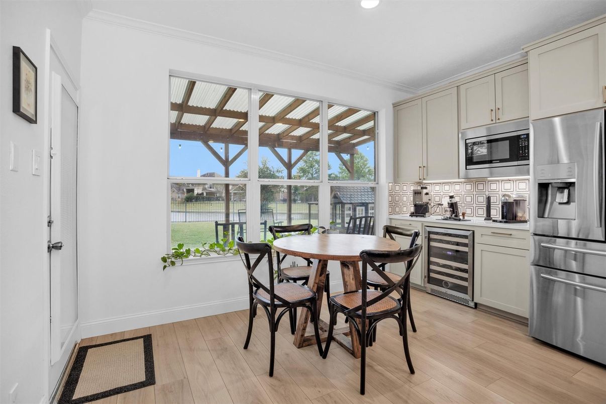 Dining room, Interior, Kitchen, Recessed Lighting, Stainless Steel Appliances, Wood Texture Flooring