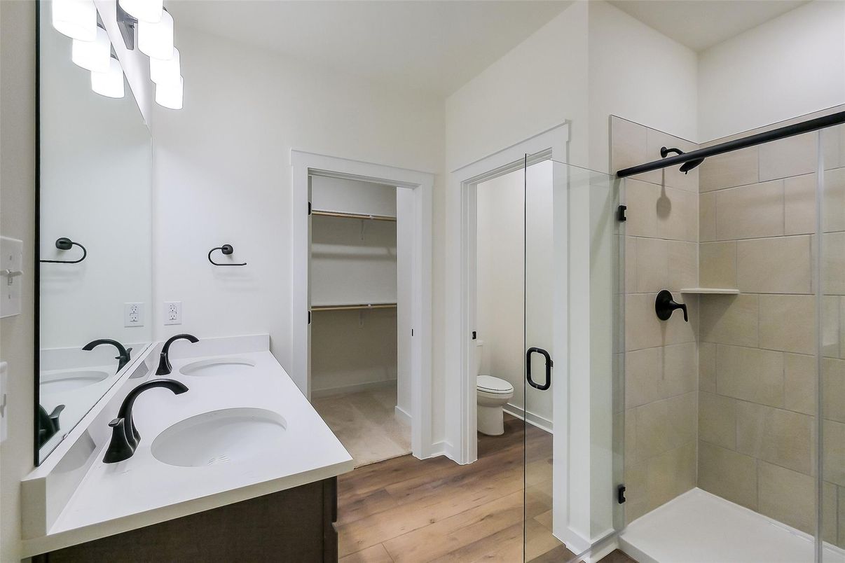 Bathroom, Dual Sink Vanities, Glass Shower, Interior, Walk-in Closets, Wood Texture Flooring