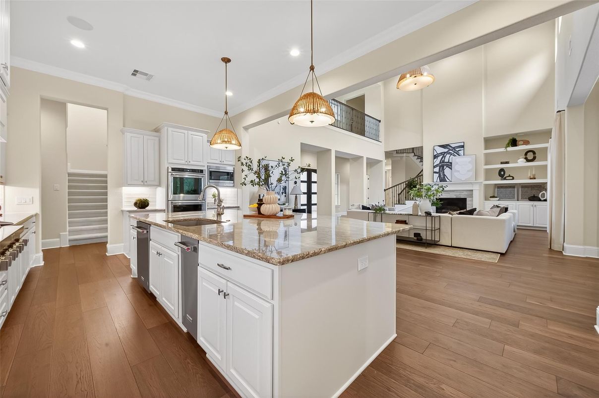 Fireplace, Interior, Kitchen, Living room, Pendant Lights, Recessed Lighting, Stainless Steel Appliances, Wood Texture Flooring