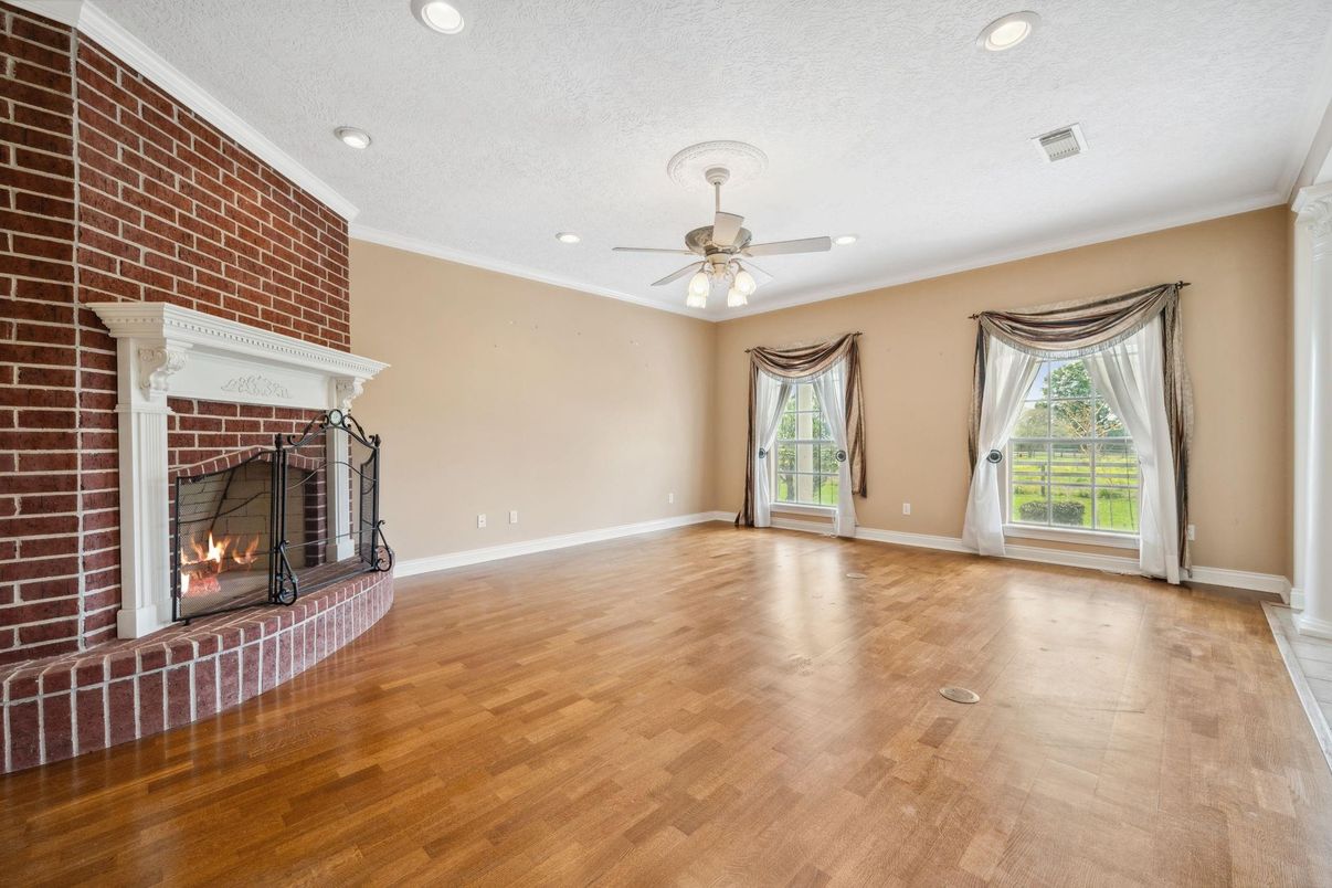 Empty room, Fireplace, Interior, Recessed Lighting, Stone Walls, Wood Texture Flooring