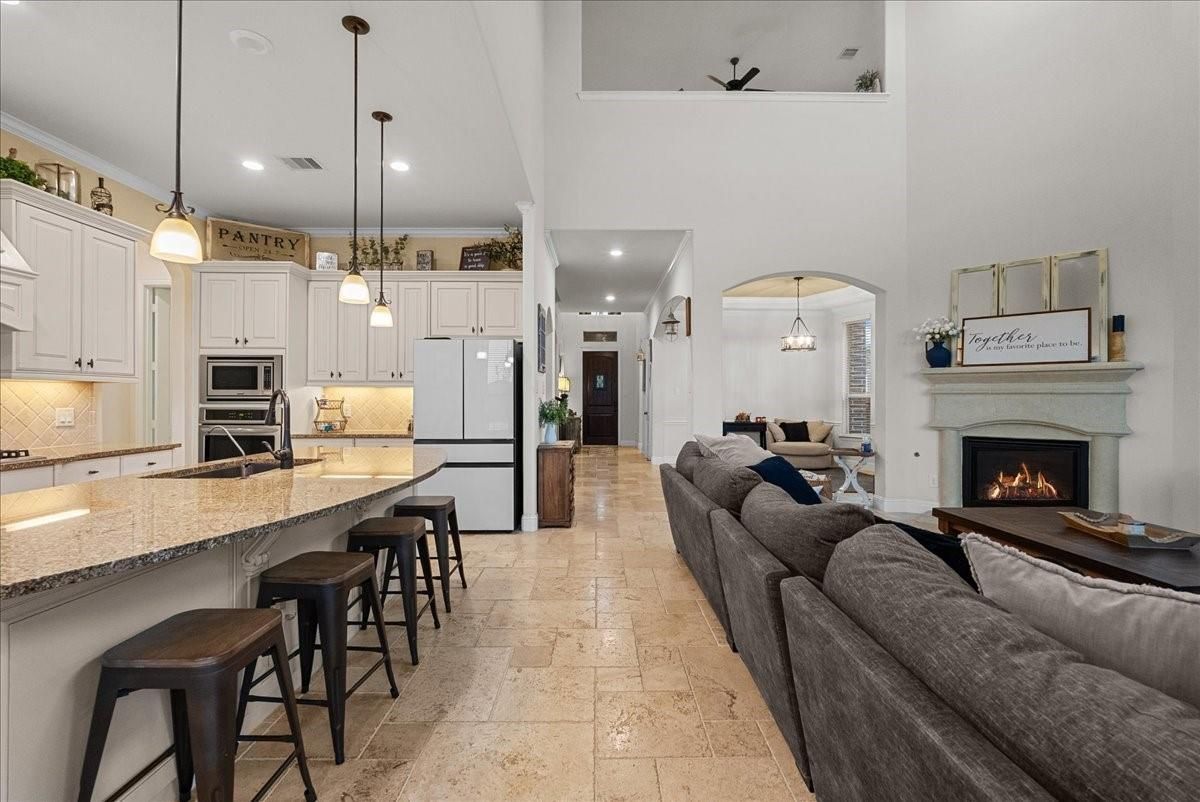 Dining room, Fireplace, Interior, Kitchen, Living room, Pendant Lights, Recessed Lighting, Stainless Steel Appliances