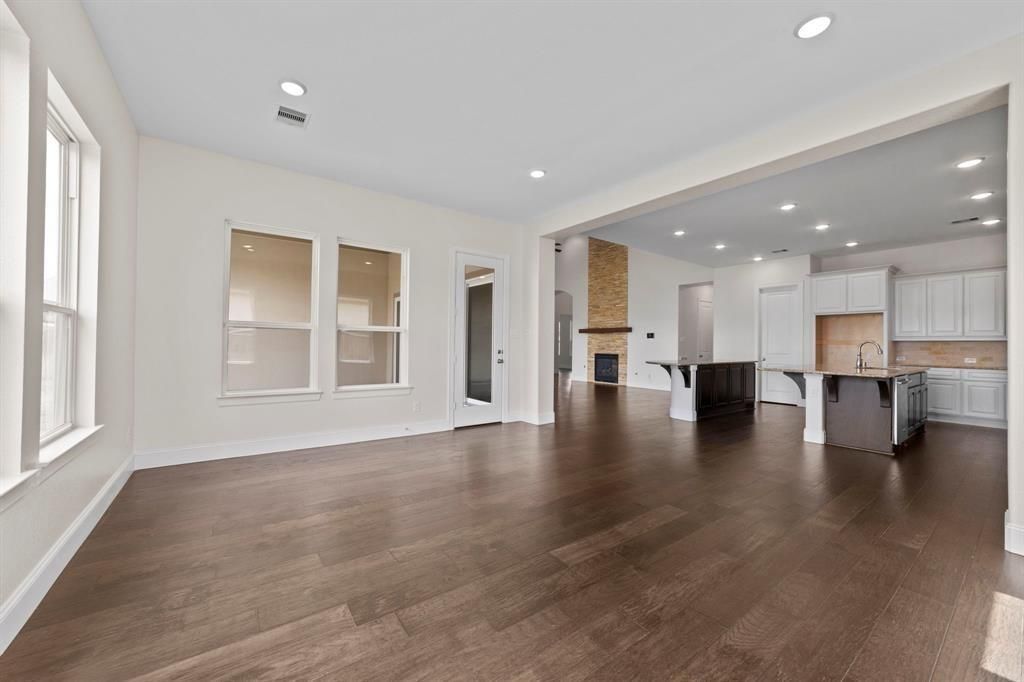 Empty room, Fireplace, Interior, Kitchen, Recessed Lighting, Wood Texture Flooring