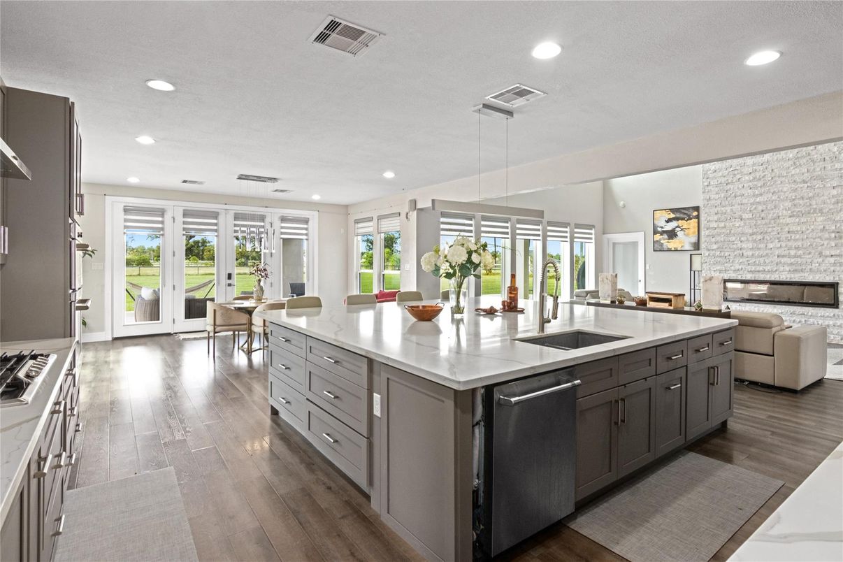 Dining room, Interior, Kitchen, Living room, Pendant Lights, Recessed Lighting, Stainless Steel Appliances, Wood Texture Flooring