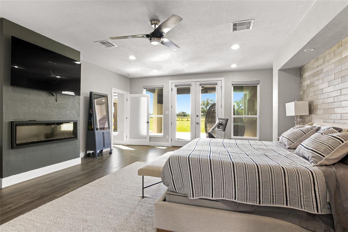 Bedroom, Fireplace, Interior, Recessed Lighting, Stone Walls, Wood Texture Flooring