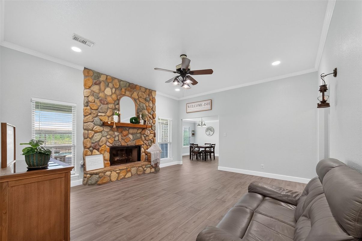 Dining room, Fireplace, Interior, Recessed Lighting, Stone Walls, Wood Texture Flooring