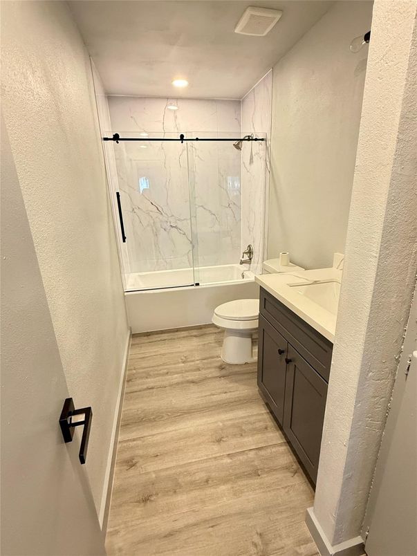 Bathroom, Glass Shower, Interior, Marble Walls, Recessed Lighting, Wood Texture Flooring