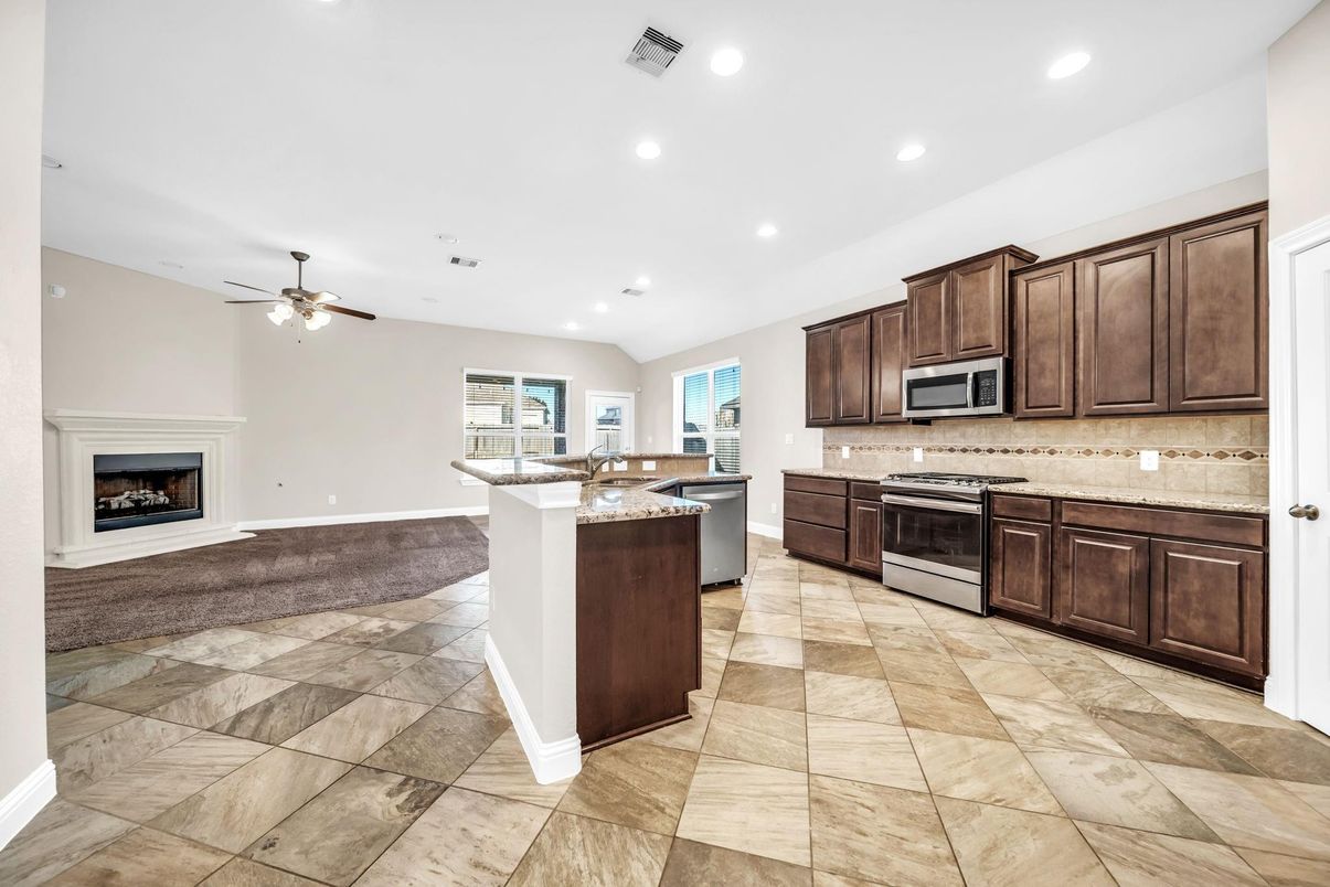 Fireplace, Interior, Kitchen, Recessed Lighting, Stainless Steel Appliances