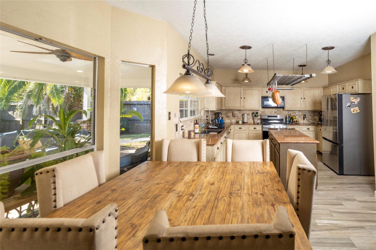 Dining room, Interior, Kitchen, Pendant Lights, Stainless Steel Appliances, Wood Texture Flooring