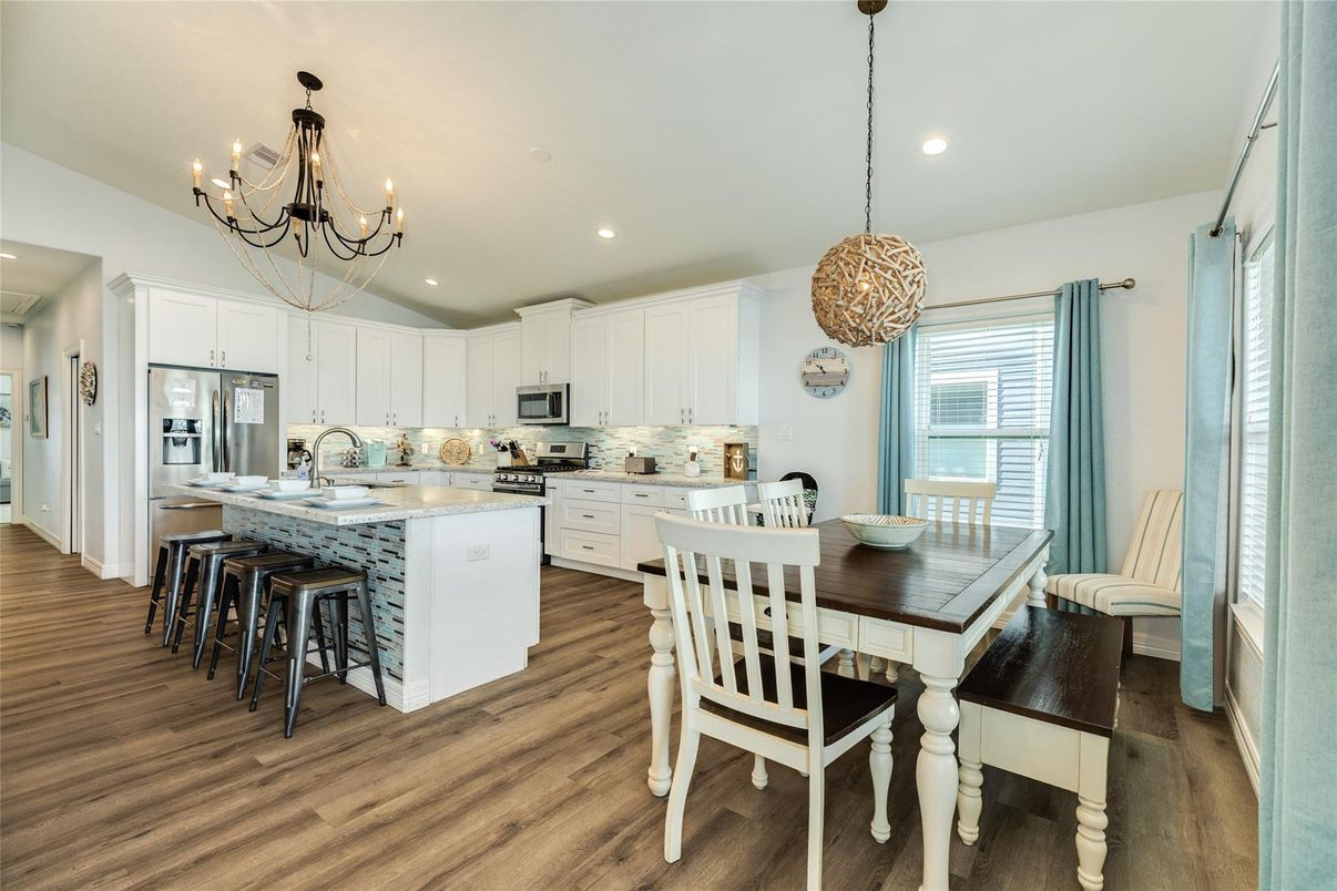 Chandelier, Dining room, Interior, Kitchen, Pendant Lights, Recessed Lighting, Stainless Steel Appliances, Wood Texture Flooring