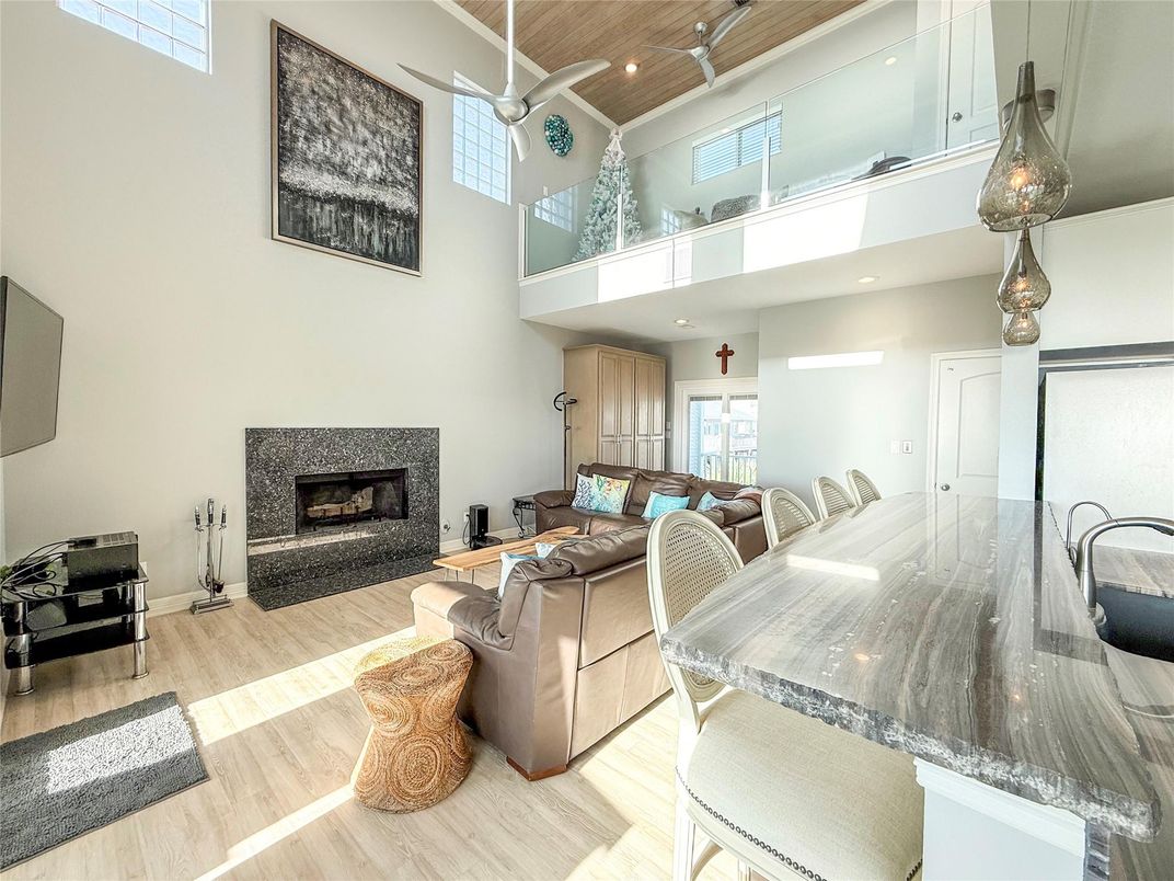 Dining room, Fireplace, Interior, Living room, Recessed Lighting, Wood Texture Flooring