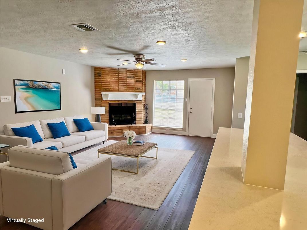 Fireplace, Interior, Living room, Recessed Lighting, Stone Walls, Wood Texture Flooring