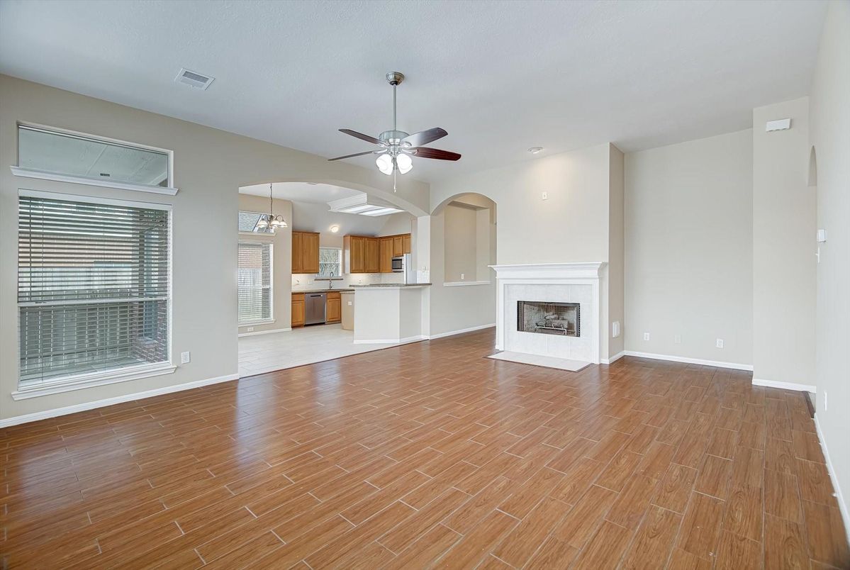 Empty room, Fireplace, Interior, Kitchen, Pendant Lights, Recessed Lighting, Wood Texture Flooring