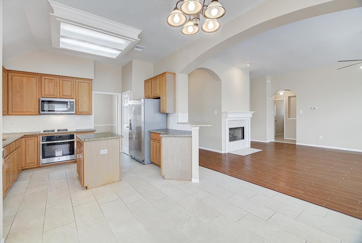 Fireplace, Interior, Kitchen, Recessed Lighting, Wood Texture Flooring