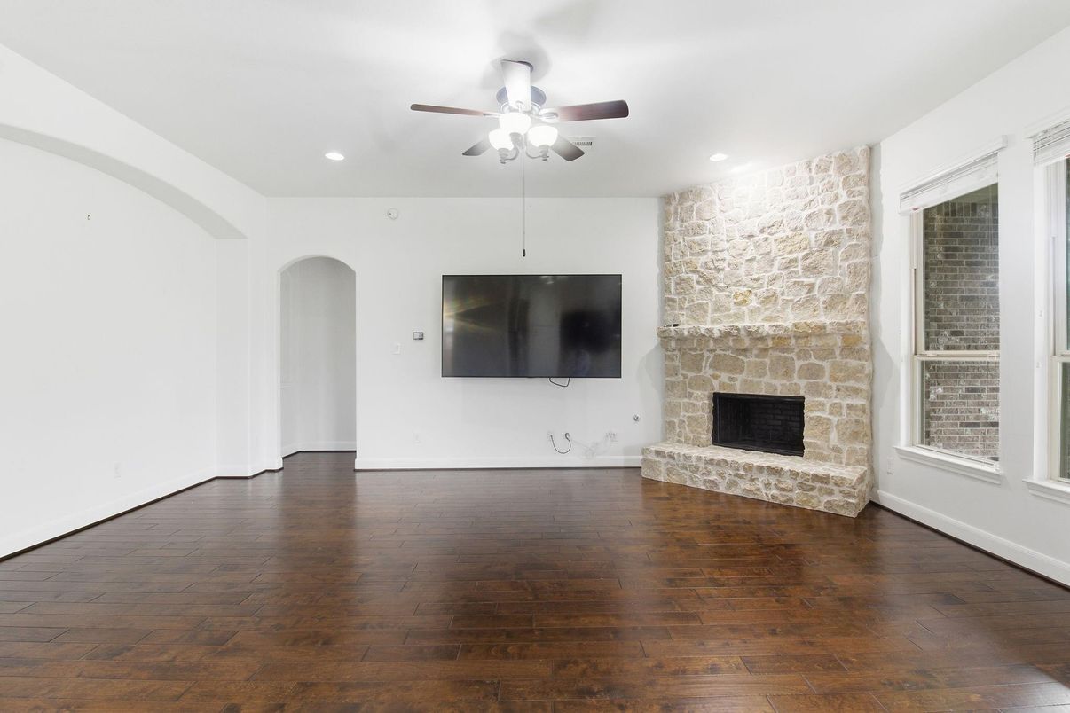 Empty room, Fireplace, Interior, Recessed Lighting, Stone Walls, Wood Texture Flooring