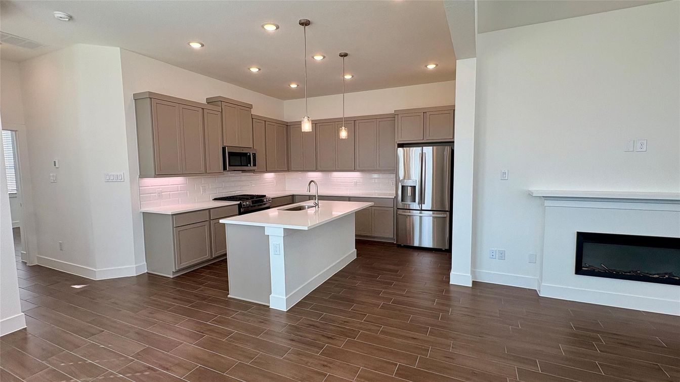 Fireplace, Interior, Kitchen, Pendant Lights, Recessed Lighting, Stainless Steel Appliances, Wood Texture Flooring