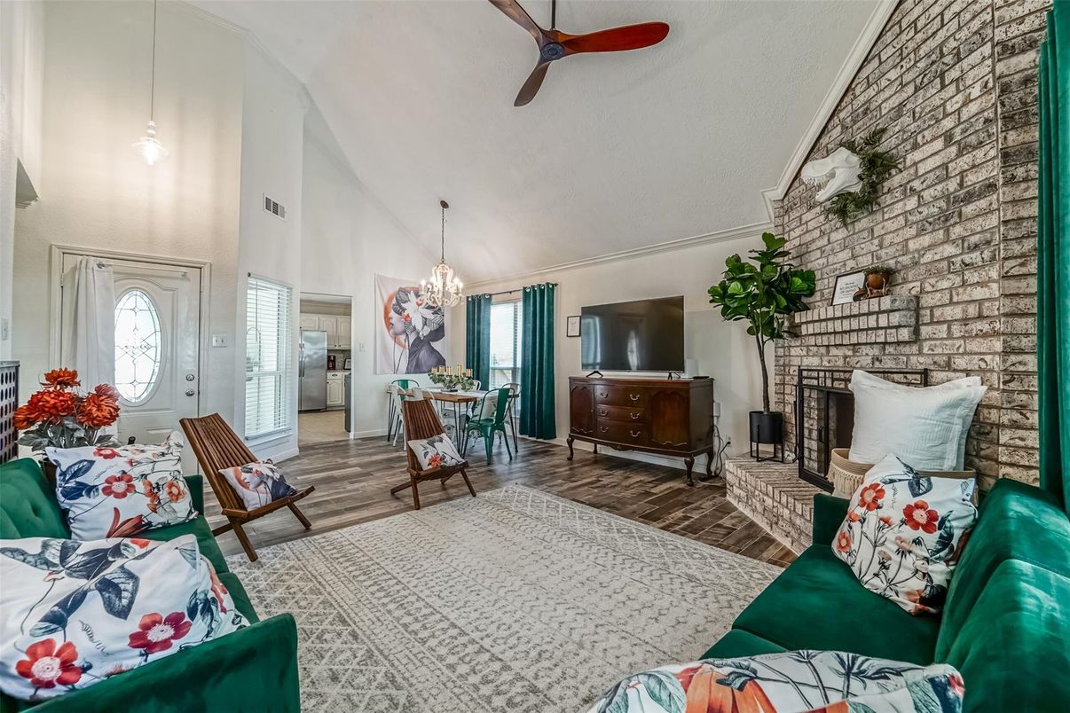 Chandelier, Dining room, Fireplace, Interior, Living room, Pendant Lights, Stone Walls, Wood Texture Flooring