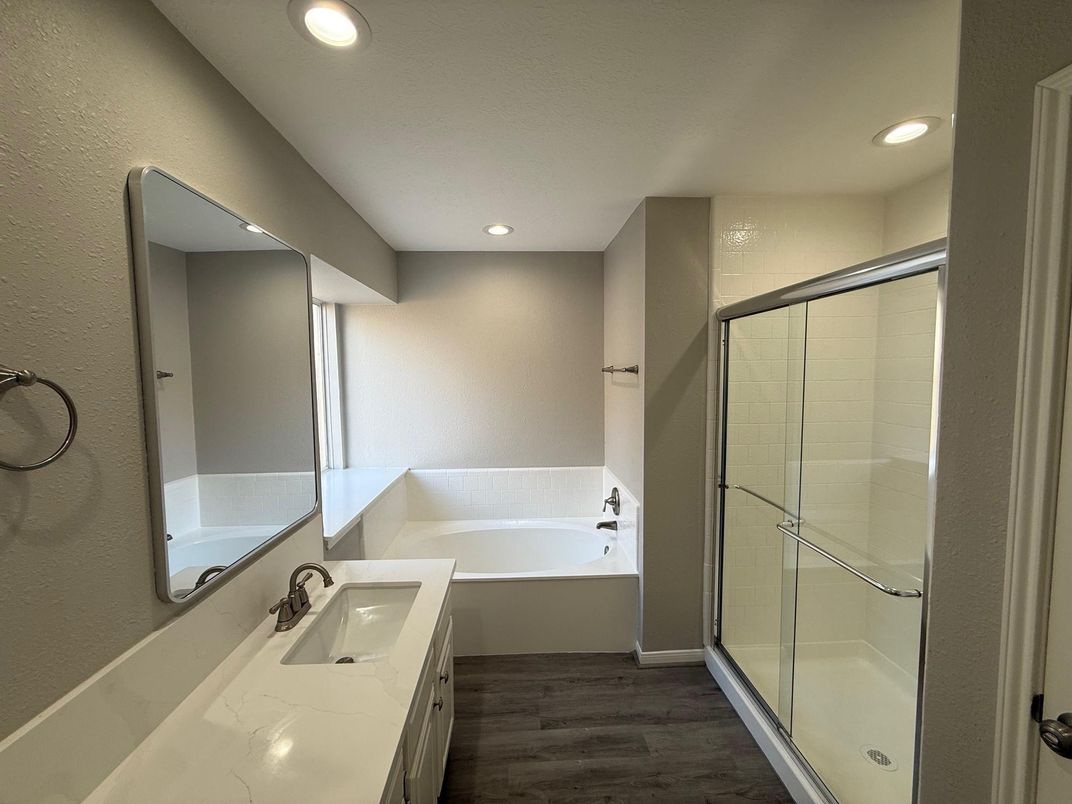 Bathroom, Dual Sink Vanities, Glass Shower, Interior, Recessed Lighting, Wood Texture Flooring