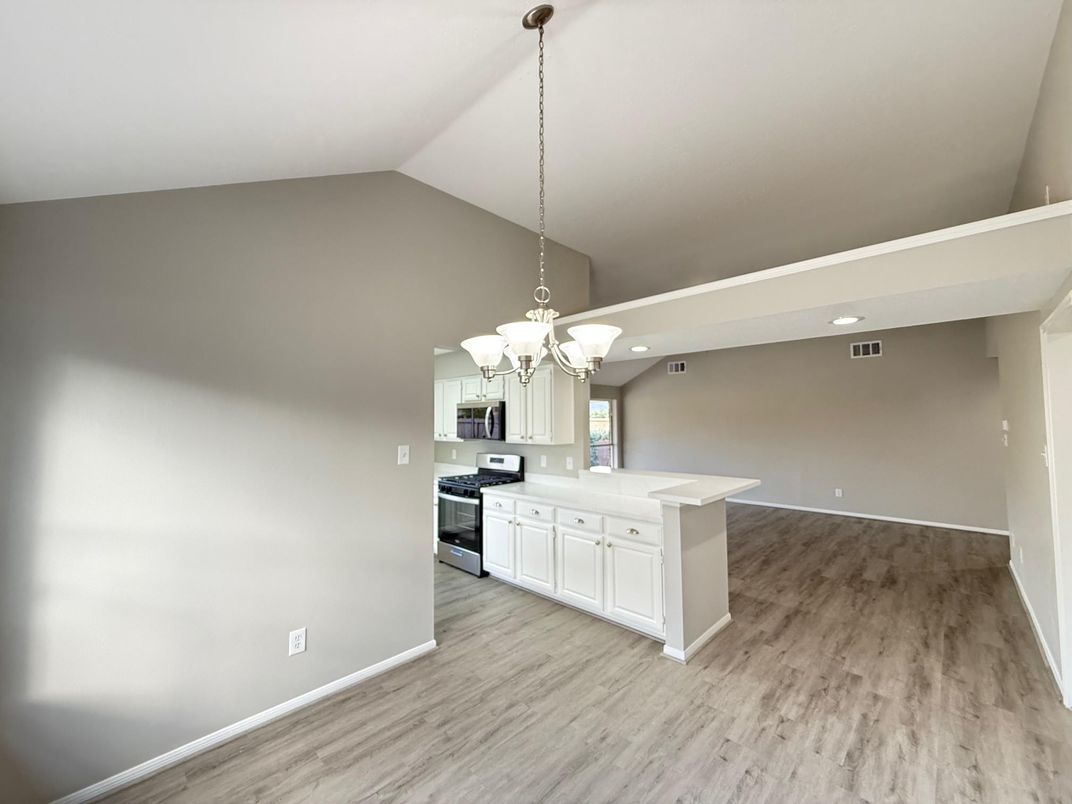 Chandelier, Interior, Kitchen, Recessed Lighting, Stainless Steel Appliances, Wood Texture Flooring