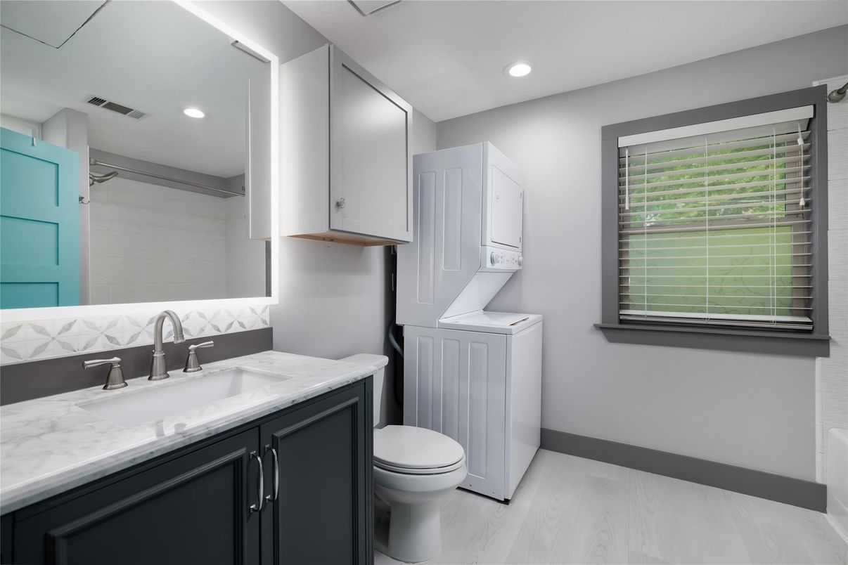 Bathroom, Interior, Recessed Lighting, Washer, Wood Texture Flooring