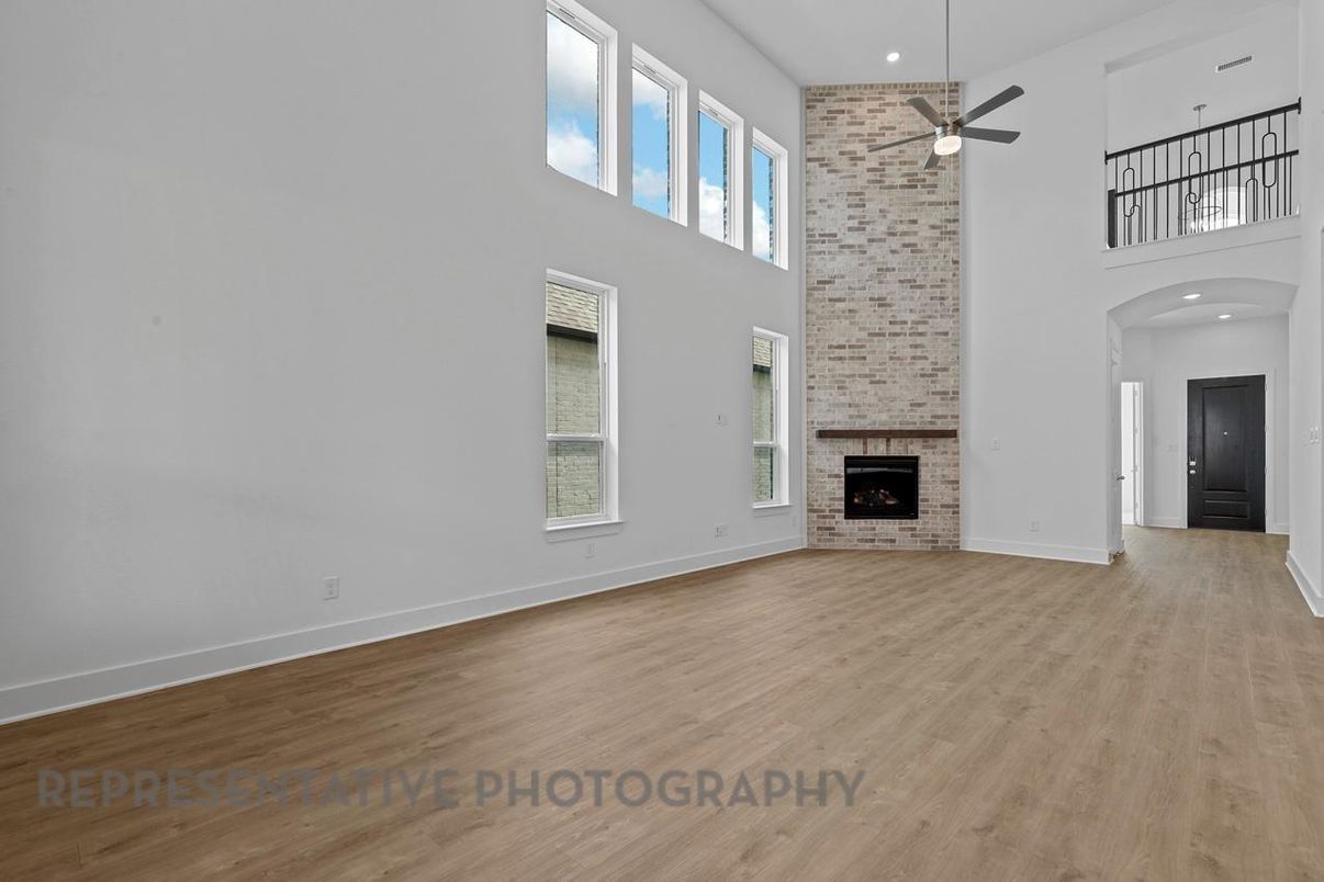 Empty room, Fireplace, Interior, Recessed Lighting, Stone Walls, Wood Texture Flooring