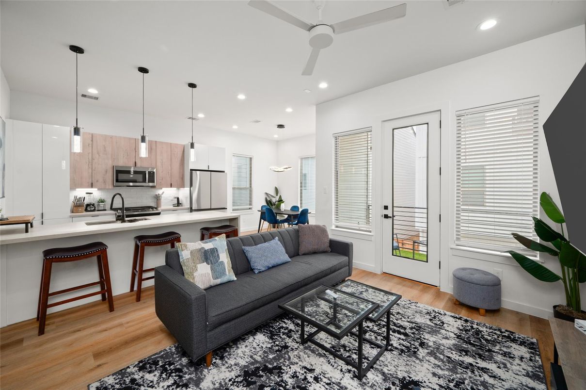 Dining room, Interior, Kitchen, Pendant Lights, Recessed Lighting, Stainless Steel Appliances, Wood Texture Flooring