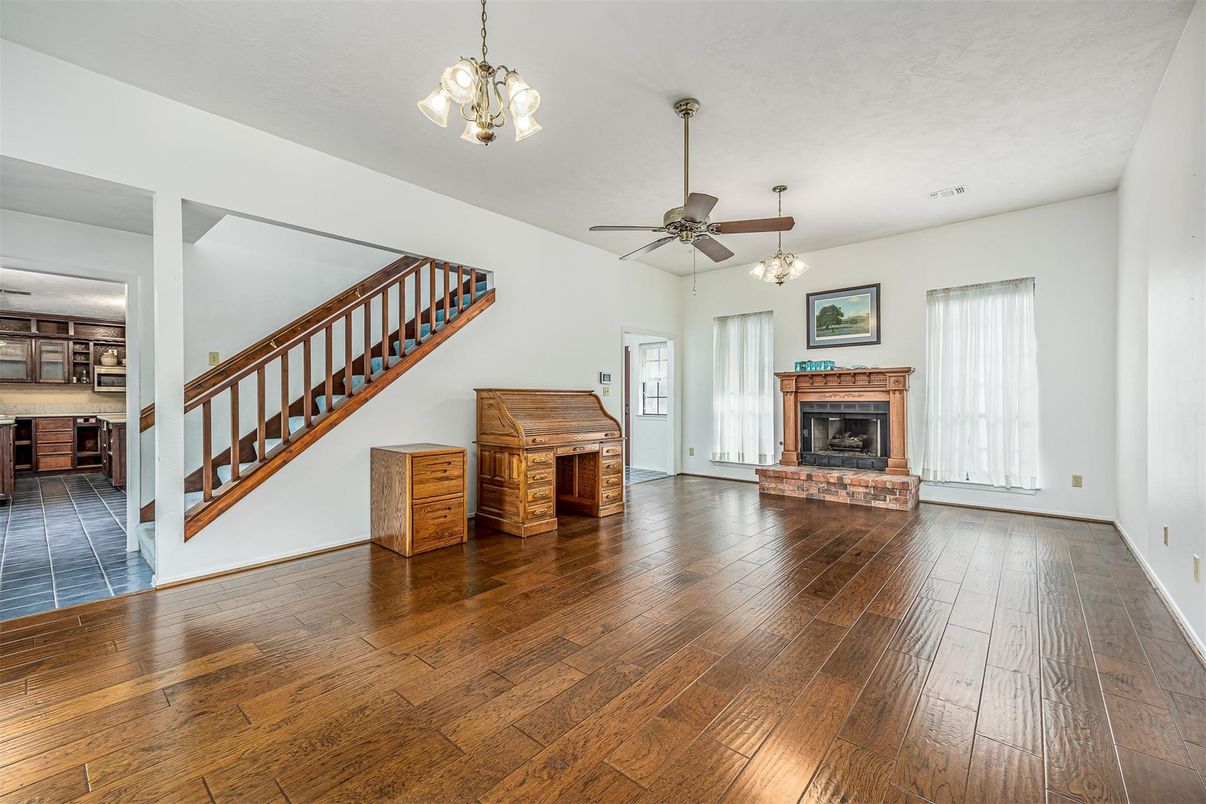 Fireplace, Interior, Pendant Lights, Piano, Wood Texture Flooring