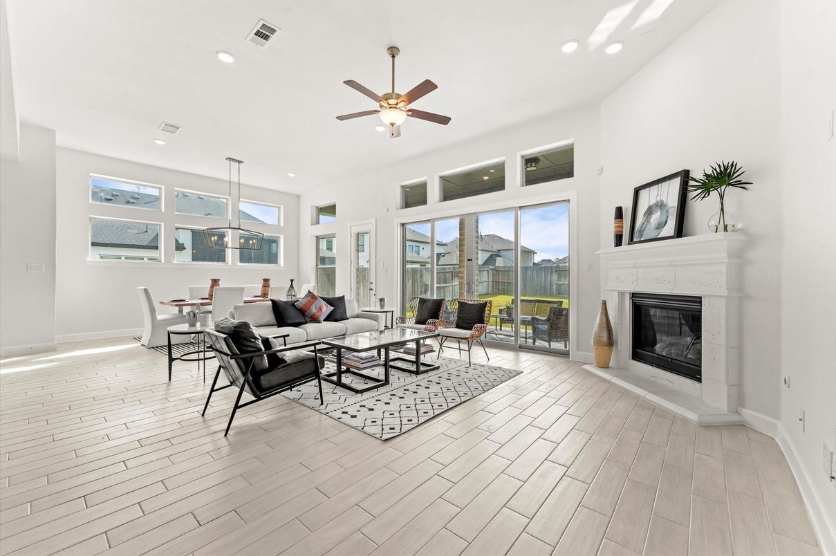 Dining room, Fireplace, Interior, Living room, Recessed Lighting, Wood Texture Flooring
