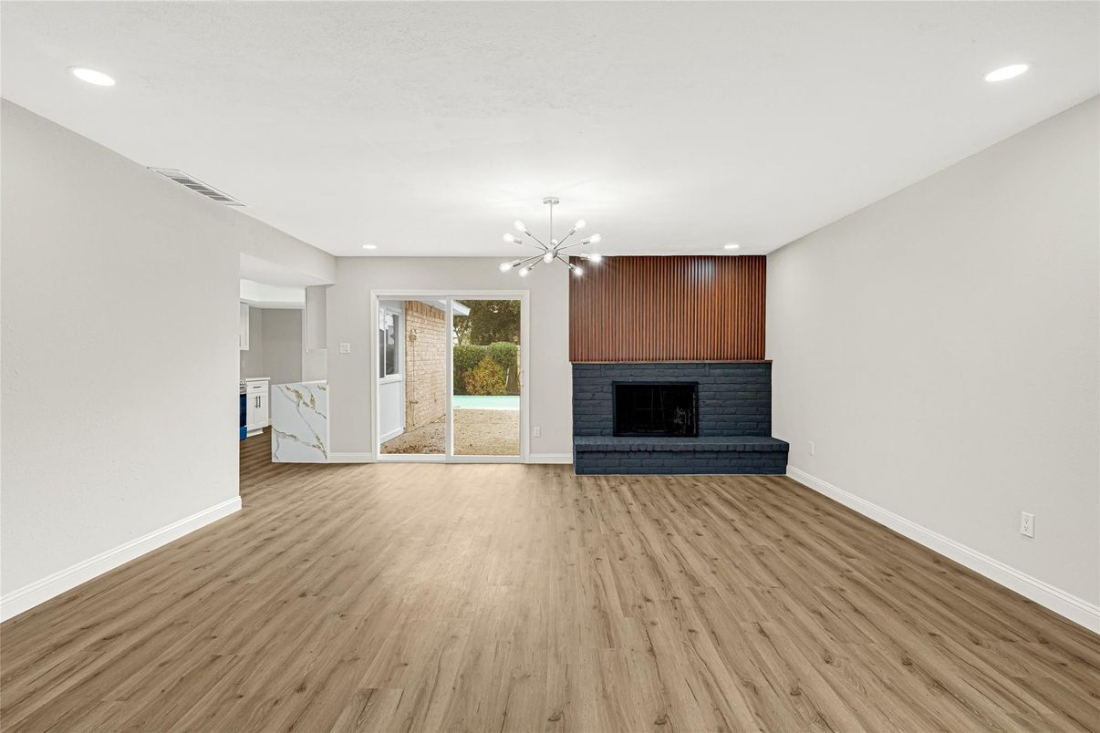 Empty room, Fireplace, Interior, Pendant Lights, Recessed Lighting, Wood Texture Flooring